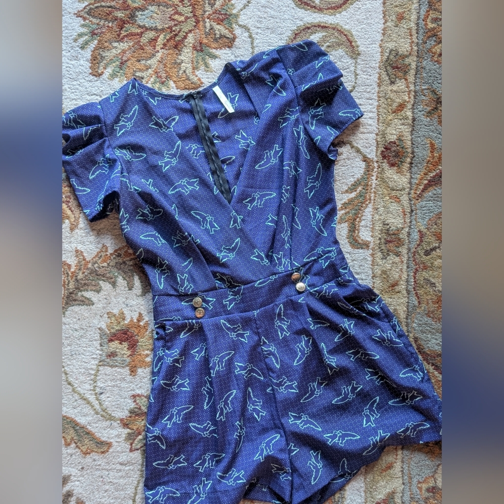 Peppermint romper in a purply blue color with teal sparrow design all over